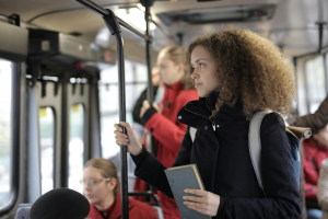 When driving isn't an option, teens use public transit. This image shows teens on a bus.