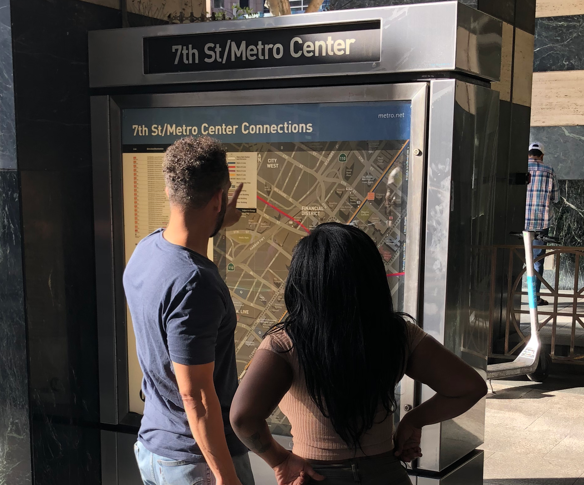 DCR Design created Connection Maps for LA Metro. This photo shows the 7th St/Metro Center Connection Map. Riders are looking at it.