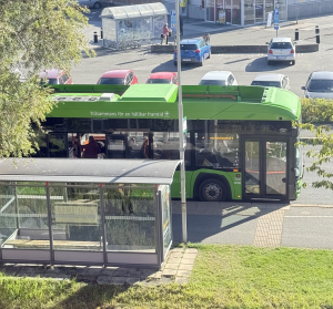 Year of the bus A bus stop near a grocery store in Sweden from a slight birds eye perspective.