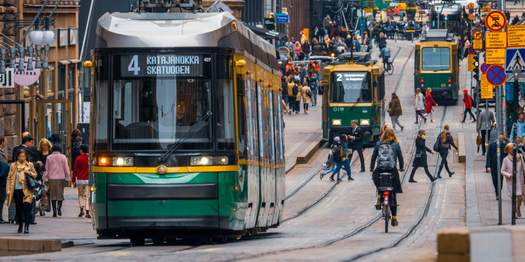 Streets of downotwn Helsinki, Finland. Active with pedestrians, bicyclists, and trams.